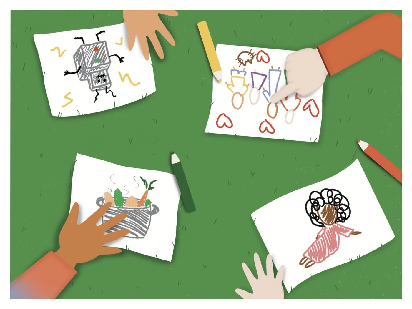 Des dessins d'enfants posés dans l'herbe